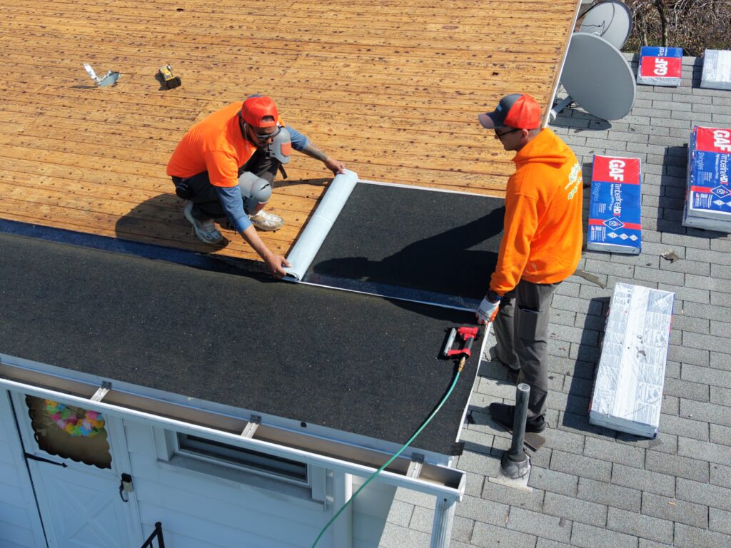 roof underlayment installation bethlehem pa crew installing ice and water shield on roof