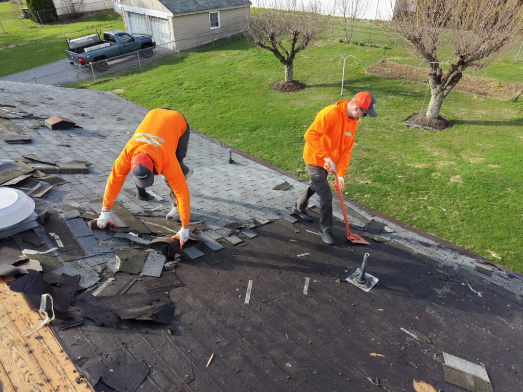 roof replacement timeline bethlehem pa crew removing shingles from residential roof