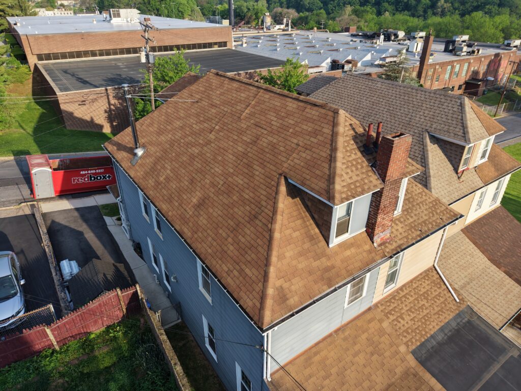 Before roof installation on townhouse in Easton PA showing old shingles prior to replacement