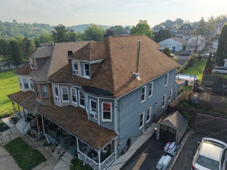 Before roof replacement on First St in Easton PA showing aged shingles