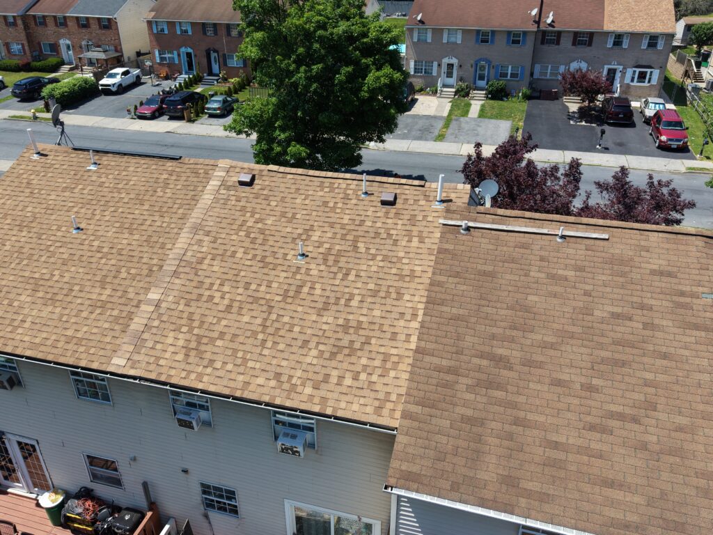 After photo — completed townhouse roof replacement in Allentown PA on E Mosser St with GAF Timberline HDZ Shakewood shingles by Roofera