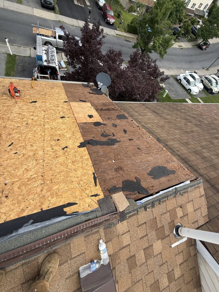 During photo — plywood decking installation during townhouse roof replacement in Allentown PA on E Mosser St by Roofera