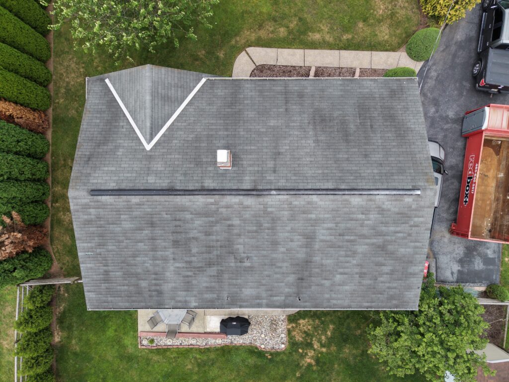 Aerial view of an aging roof valley before new installation